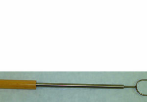 Telescopic roasting fork with two tines and a wooden handle
