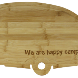 Wooden cutting board in the shape of a trailer with the text "we are happy campers"